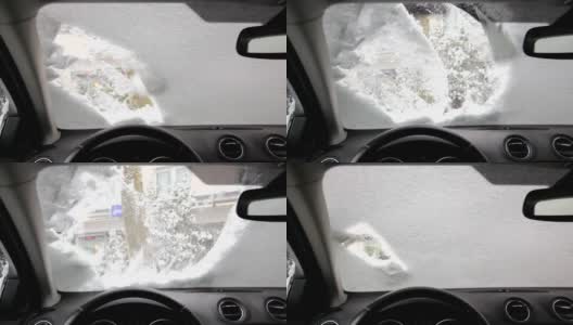 刮一辆车挡风玻璃上的冰1080p高清在线视频素材下载