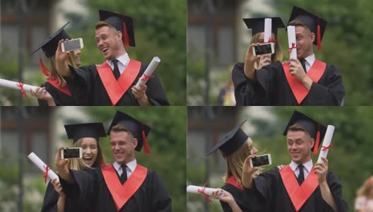 戴着学位帽和学士服在智能手机上拍摄视频的快乐男女高清在线视频素材下载
