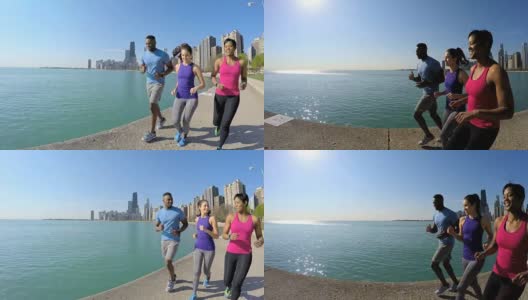 健康的多种族美国朋友在海边跑步高清在线视频素材下载