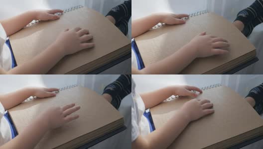 视障儿童正在用手阅读盲文高清在线视频素材下载