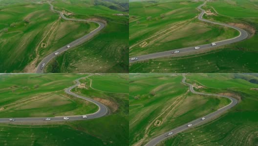 汽车在中国新疆的乡村道路上行驶的鸟瞰图。高清在线视频素材下载