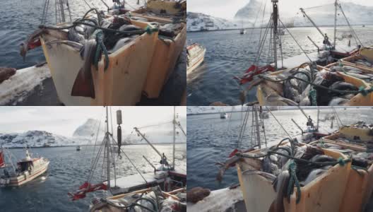 北冰洋的鳕鱼捕鱼业:装满鱼的渔船高清在线视频素材下载