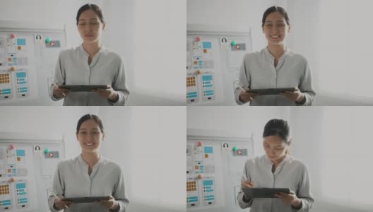肖像女商人微笑在办公室，用户界面用户体验设计师高清在线视频素材下载