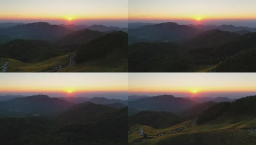 夕阳下盛开的黄色向日葵在山景上高清在线视频素材下载