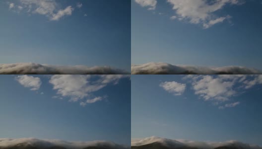 美丽的云朵缓缓飘过群山。高清在线视频素材下载