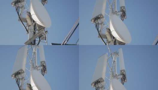 在一个阳光明媚的霜天，卫星天线安装在屋顶上。高清在线视频素材下载