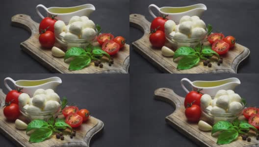 卡普里沙拉的配料:马苏里拉奶酪，西红柿，罗勒叶，橄榄油高清在线视频素材下载