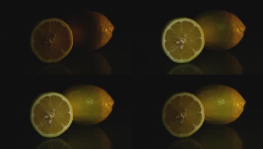 两个柠檬躺在黑暗的背景上高清在线视频素材下载