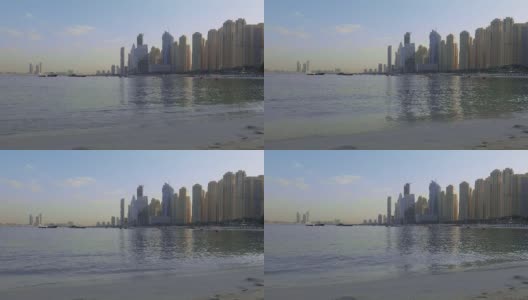 商务湾区全景，晨光映照大海。阿拉伯联合酋长国迪拜中心最高建筑的天空。高清在线视频素材下载