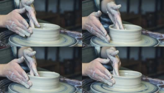 陶工学徒的双手正试图在陶工轮上对齐产品的边缘高清在线视频素材下载