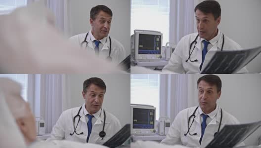 经验丰富的医生告诉病人x光结果高清在线视频素材下载