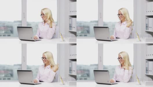 戴眼镜的女秘书或学生，用笔记本电脑在办公室打字高清在线视频素材下载
