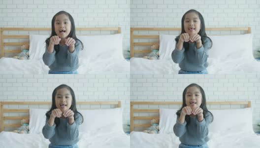 亚洲女孩做手势，小狗脸，吐舌头高清在线视频素材下载