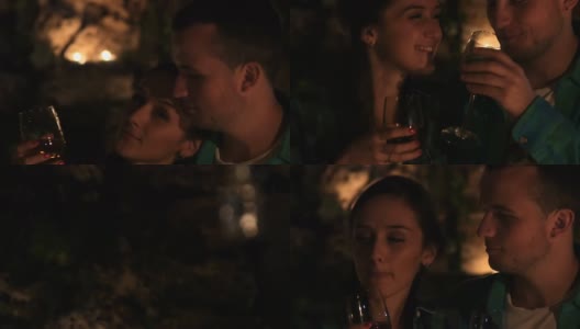 相爱的年轻情侣在烛光下喝酒亲吻高清在线视频素材下载