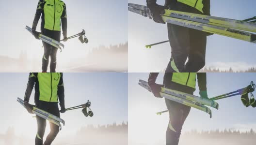 越野滑雪者在冬季景观携带他的运动设备高清在线视频素材下载