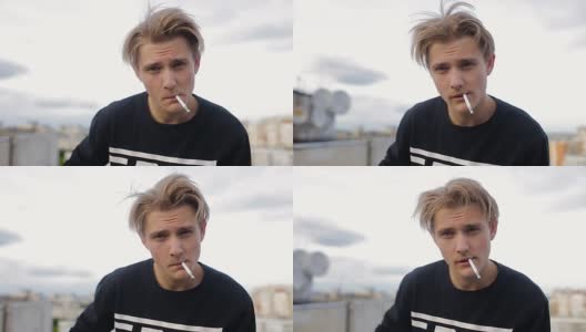 画一个酷酷的年轻人在屋顶上抽烟高清在线视频素材下载