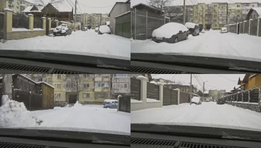 冬天的天气就在汽车路上——飘落的雪花高清在线视频素材下载