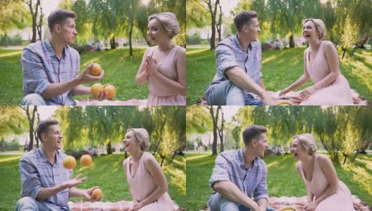 男朋友给女士惊喜，用橘子玩杂耍高清在线视频素材下载
