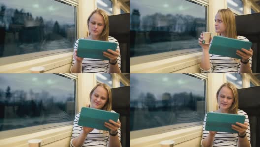 在火车上拿着触摸板和茶的女人高清在线视频素材下载