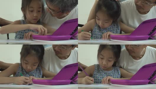 亚裔父亲和女儿在家画画高清在线视频素材下载