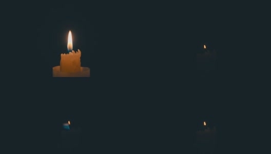 在黑色背景上吹着燃烧的蜡烛。莫慢，莫慢高清在线视频素材下载
