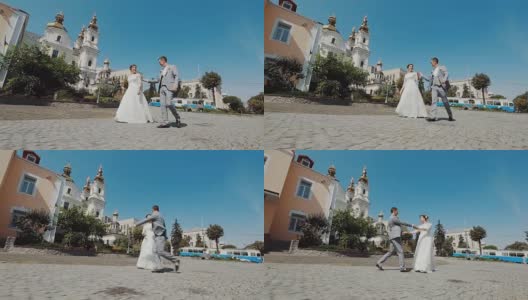 新婚夫妇在婚礼上走在街上。高清在线视频素材下载