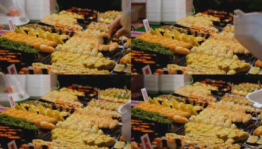 宗田夜市柜台上的亚洲寿司。泰国芭堤雅高清在线视频素材下载