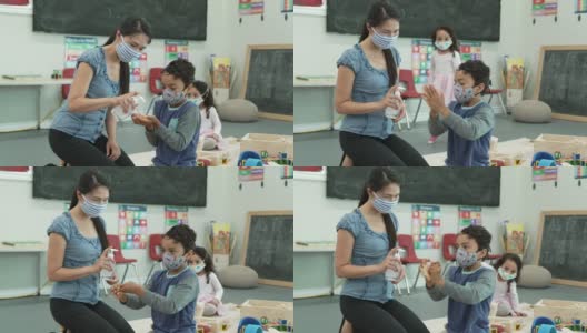 日托老师提供洗手液给孩子高清在线视频素材下载