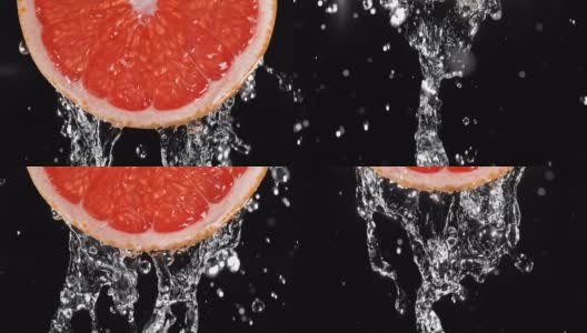 水倒在背光多汁葡萄柚片上高清在线视频素材下载