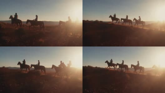 在夏季黄昏的纪念碑谷部落公园附近的沙漠里，纳瓦霍印第安人骑着他们的马高清在线视频素材下载