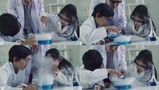 亚洲小女孩在科学教室，快乐的孩子和微笑在科学教室。高清在线视频素材下载