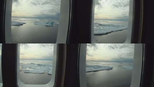 北冰洋游艇舷窗上的冰和冰山。高清在线视频素材下载
