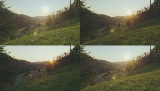时间流逝，夕阳越过起伏的山丘。农村景观。瑞士的农舍。广州苏黎世。高清在线视频素材下载