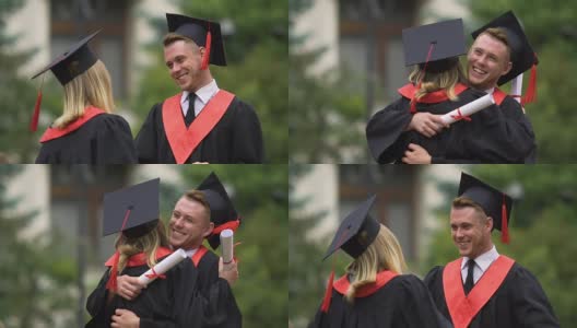 毕业典礼后年轻的毕业生拥抱着，美丽的人们微笑着高清在线视频素材下载