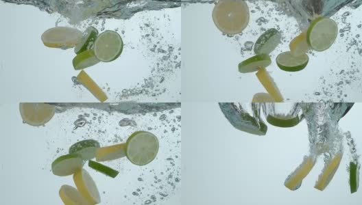 柠檬片和酸橙片在慢镜头中溅入水中高清在线视频素材下载