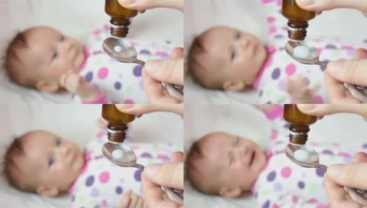 给婴儿滴一勺药高清在线视频素材下载