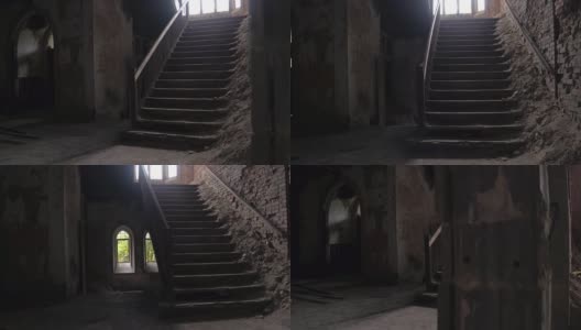 近距离观察:老教堂暗室石柱后的久经风雨的楼梯高清在线视频素材下载