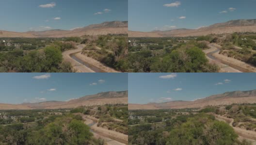 夏末无人机查看科罗拉多河流域农业绿地和水处理和BookCliff山脉4K视频系列高清在线视频素材下载