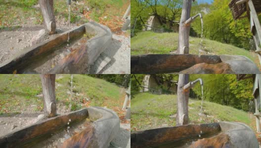 水从立管泵流入公园的木槽高清在线视频素材下载