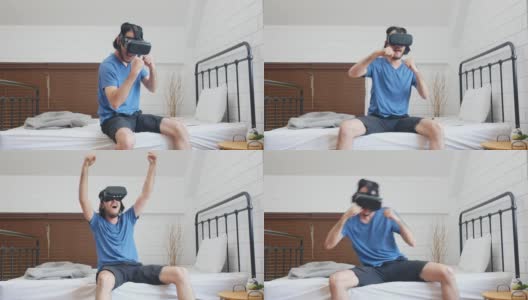 年轻的亚洲男人用虚拟现实眼镜与幸福的卧室，人在幸福的时刻，生活方式，人和技术高清在线视频素材下载