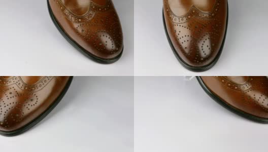 特写，旋转一个时尚的经典棕色鞋带鞋。高清在线视频素材下载