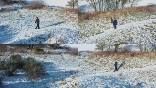 在苏格兰西南部，一名老人独自走在一条被雪覆盖的人行道上高清在线视频素材下载