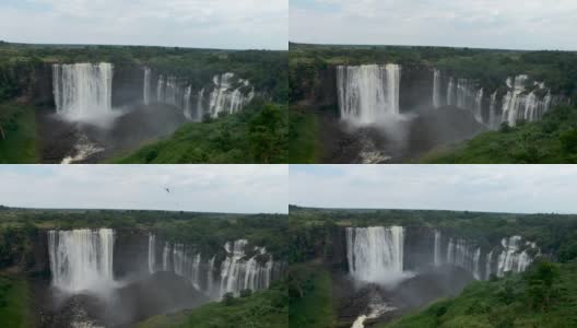 遥远的风景Calandula瀑布在安哥拉，燕子飞周围的相机雾瀑布空中高清在线视频素材下载
