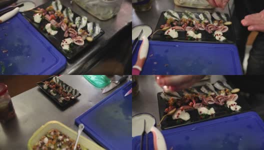 厨师使用异国香料为盘子调味海鲜高清在线视频素材下载