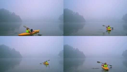 在河雾中划独木舟高清在线视频素材下载