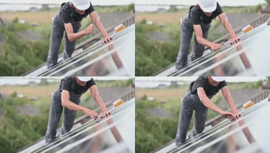 在屋顶安装光伏太阳能板的工人高清在线视频素材下载