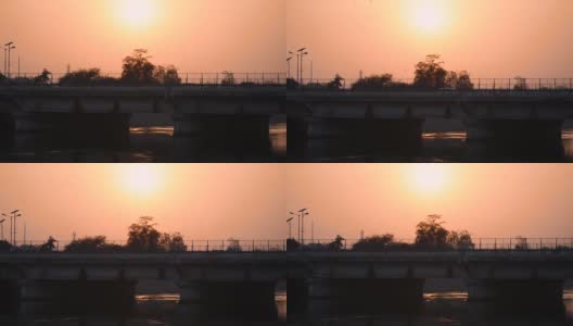 纳尔默达运河桥在日落在甘地那格-艾哈迈达巴德路，艾哈迈达巴德，古吉拉特邦，印度。过桥车辆。高清在线视频素材下载