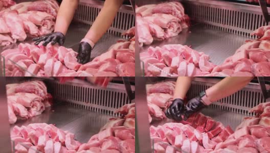 特写推销员把生的红肉排骨陈列在橱窗里高清在线视频素材下载