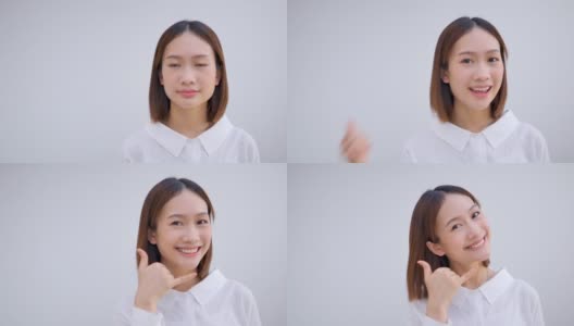 亚洲女孩愿意做出手机手势假装用手机沟通肢体语言的概念高清在线视频素材下载