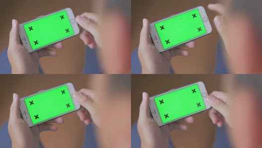 过肩拍摄使用智能手机，绿色屏幕高清在线视频素材下载